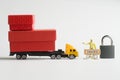 Toy truck with trailer loaded with boxes of goods is stopped next to a prohibition road sign, customs officer and padlock. ÃÂ¡